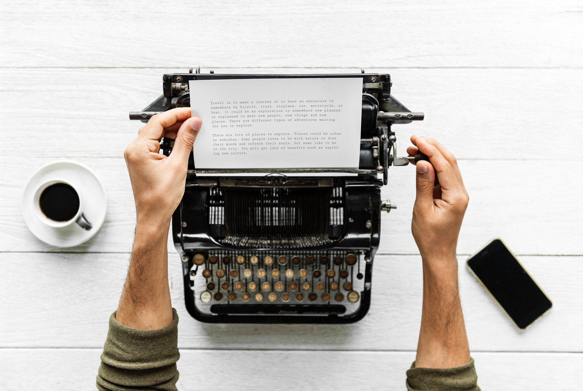 Adult typing on a typewriter